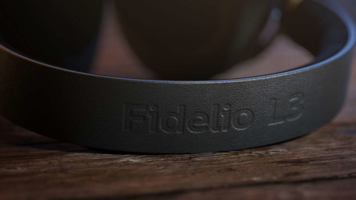 Philips Fidelio wireless headphones paired via Bluetooth with smartphone for music