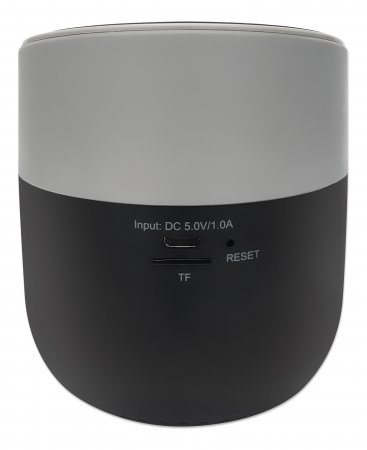 Manhattan Metallic round portable speaker angled on table