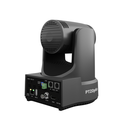 Outdoor installation of PTZOptics PT12X-LINK-4K-GY monitoring a parking lot at night with infrared illumination