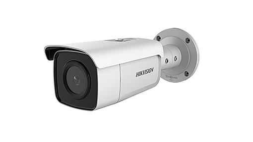Hikvision DS-2CD2T86G2-2I bullet camera mounted on a white wall outdoors